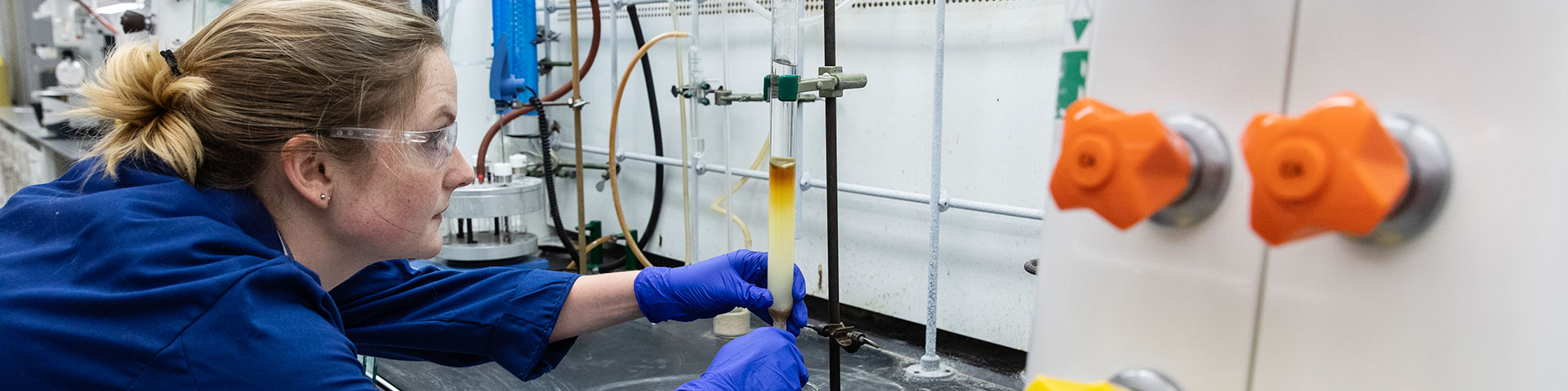 Environmental & Green Chemistry student working on an experiment in a lab