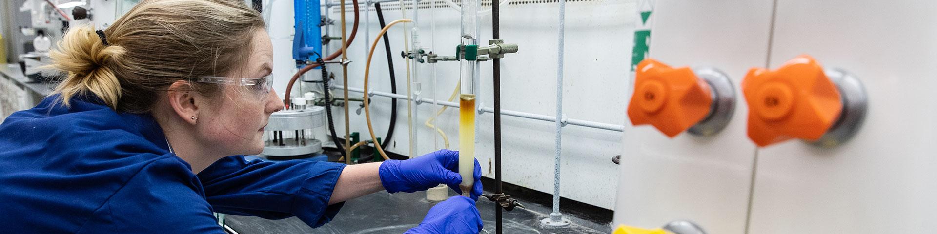 Environmental & Green Chemistry student working on an experiment in a lab
