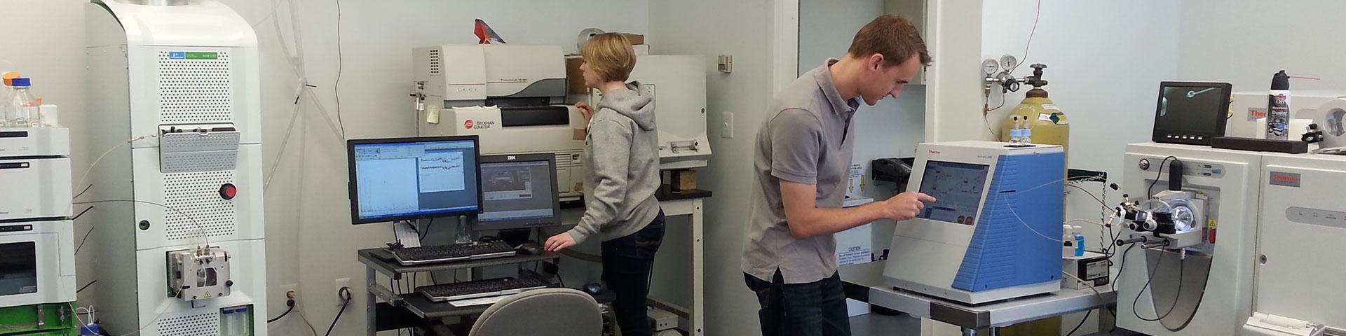 Two students working with forensic sciences equipment